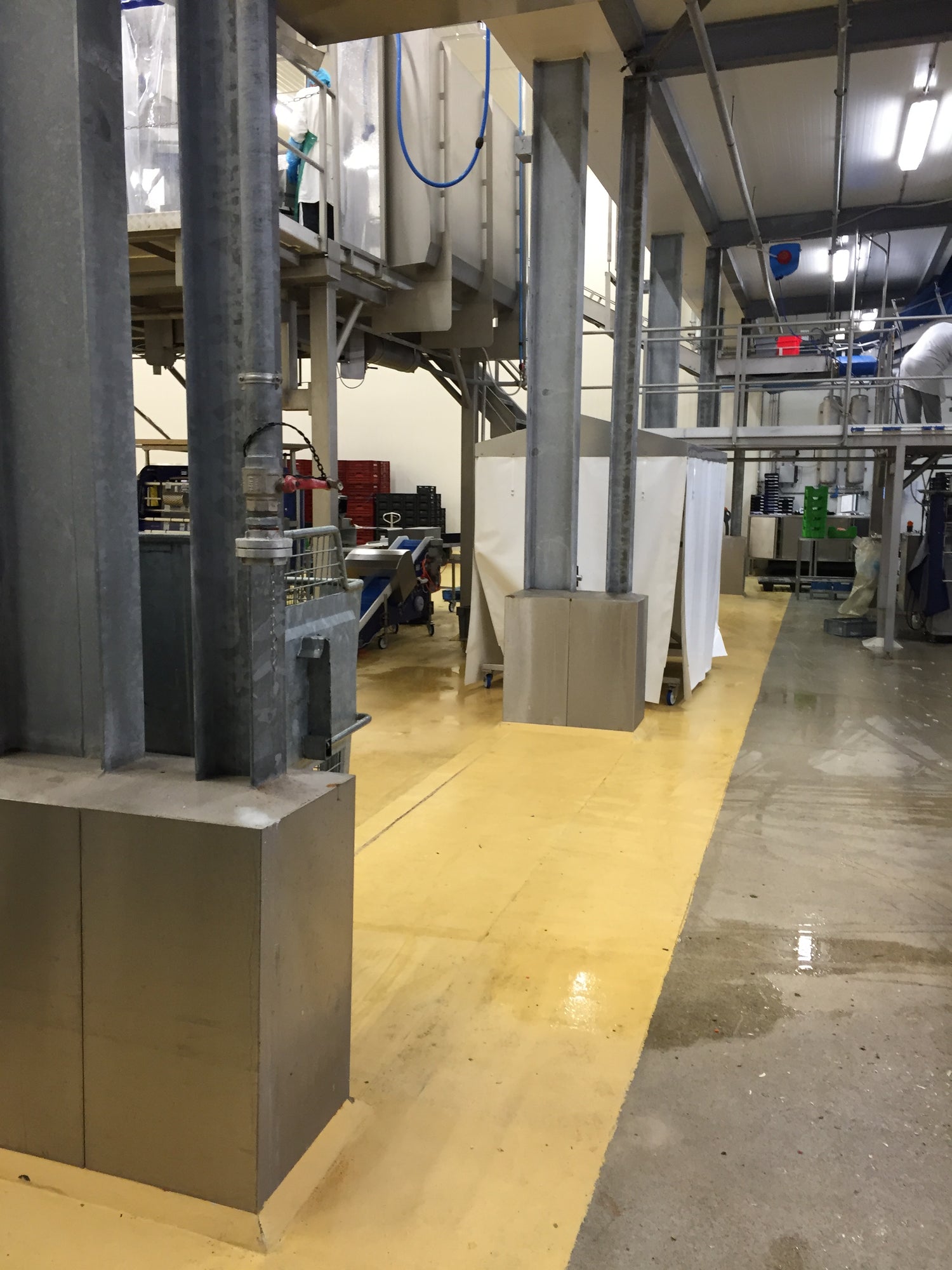 Industrial setting with metal structures and concrete floor