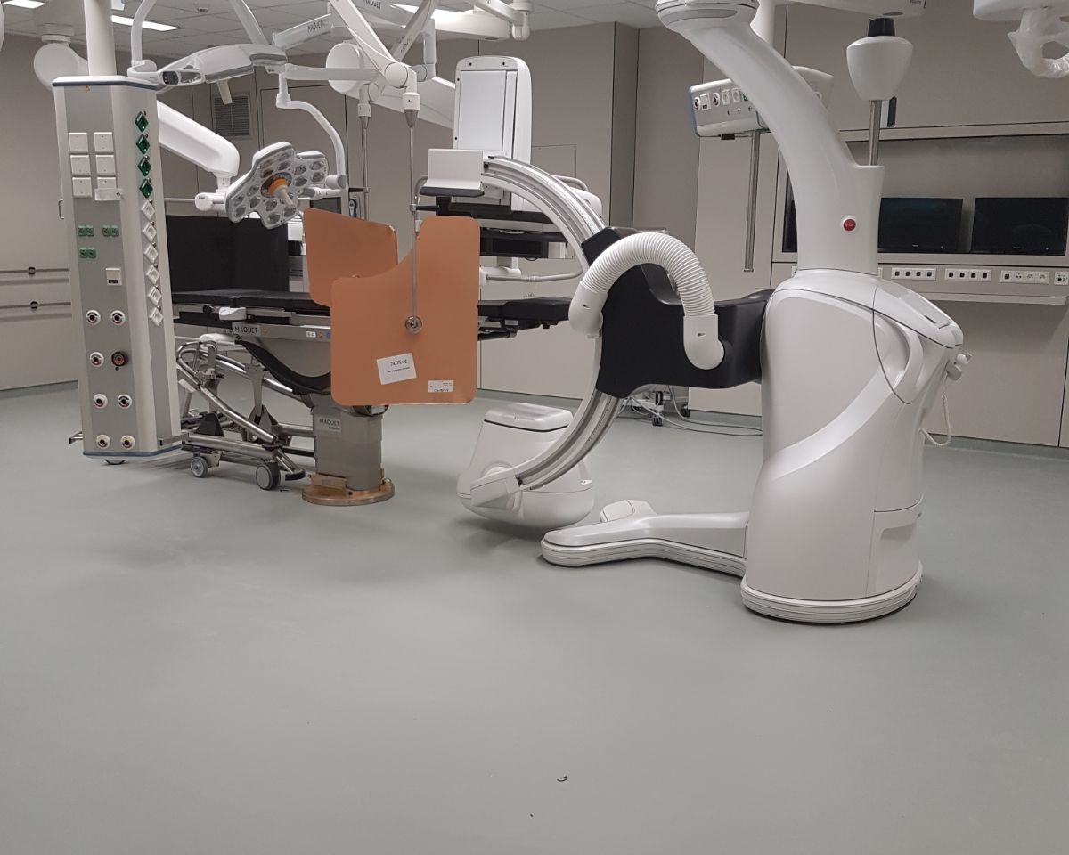 Dental operating microscope and chair in a clinical setting